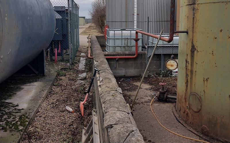 The 25,000L kerosene spill source was found to be an old fuel storage tank on the policyholder's site. The impacted tank storage area is shown here, including additional tanks which required removal prior to full remediation and reinstatement.